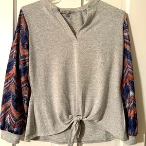 Grey top with patterned sleeves